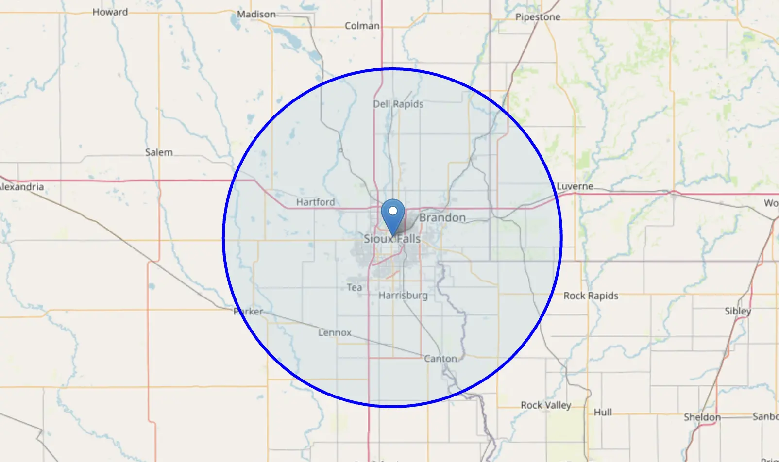 Map of the Sioux Falls area with a blue circle marking the service radius, covering Brandon, Harrisburg, Tea, Hartford, Crooks, Dell Rapids
